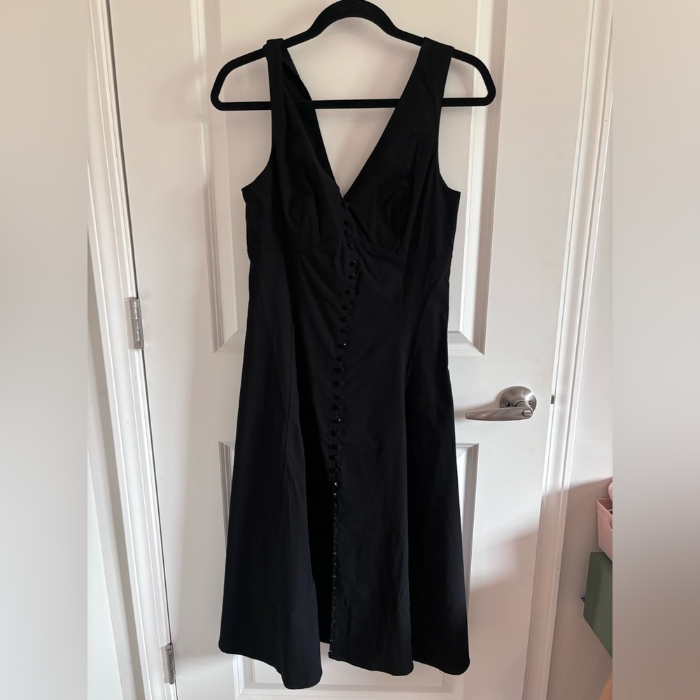 Anthropology black v neck dress with button front detail.
